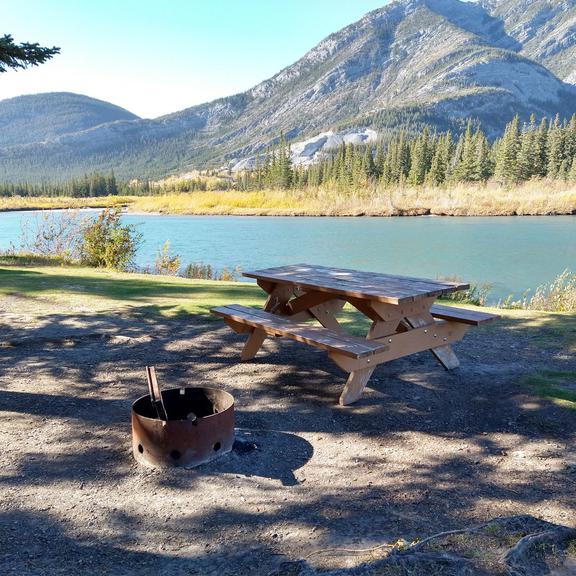 Picnic table and fire pit at Bow Valley Provincial Park