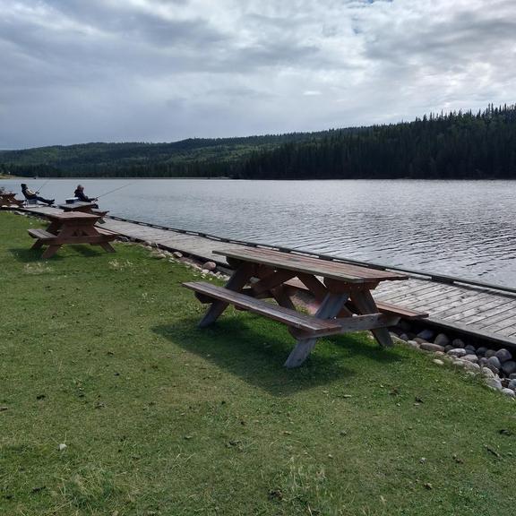 Picnic tables at the Reesor Lake dock in Cypress Hills Provincial Park