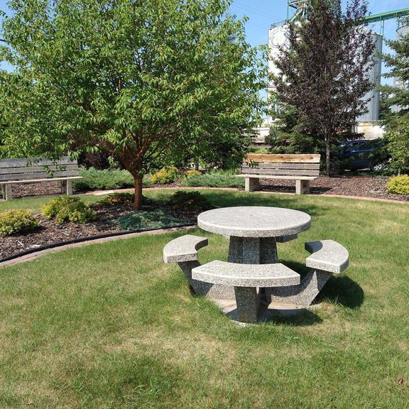 Picnic table and benches at Dr. Georges L Whissell Park