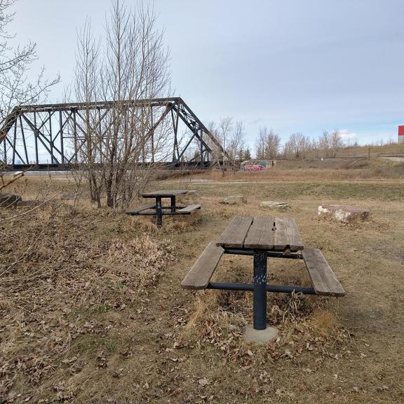 Picnic tables and rail bridge at the Western Headworks Main Canal