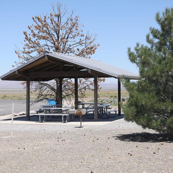 Covered picnic table and charcoal grill at Cosgrave Rest Area