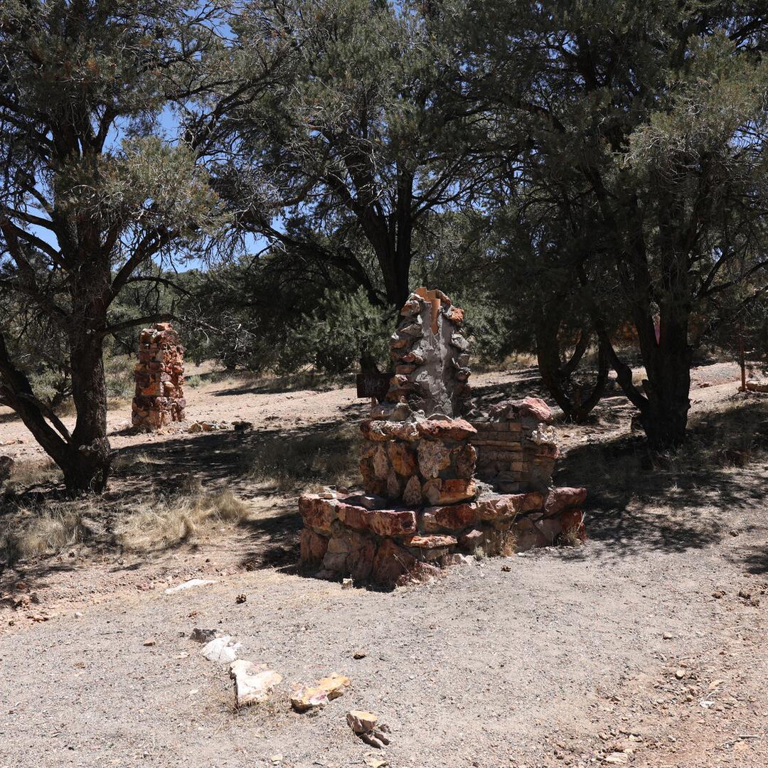 The remains of a wood grill and a cairn at Geiger Lookout Wayside Park